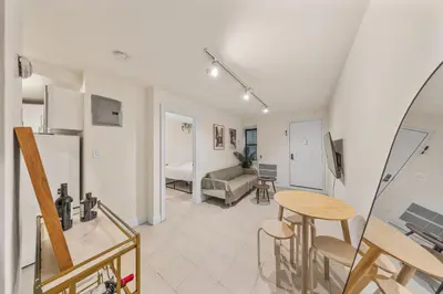a living room with a table and a couch at Oasis Apartment in the Heart of Union Square Downtown Manhattan in New York