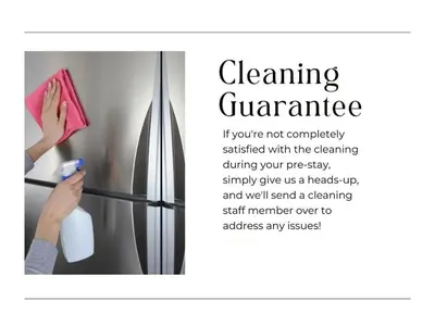 a woman is cleaning a refrigerator with a towel at Modern Condo DWNTN Hartord XL Center GYM in Hartford