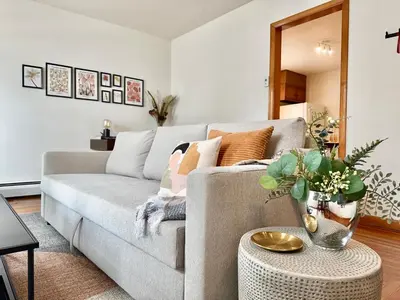 a living room with a couch and a table at Downtown New Haven by Yale & Little Italy - AO Destinations in New Haven