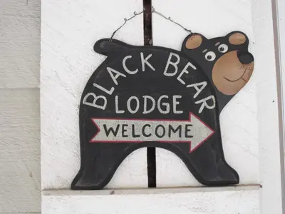 a sign for a black bear lodge welcome at Black Bear Lodge in Prattsville