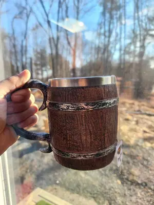 a person holding a coffee cup in a window at The Dome house near Hunter and Hudson in Catskill