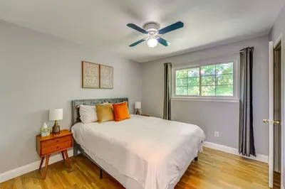 a bedroom with a bed and a ceiling fan at NYC-Area Escape Near River, Trails and MTA! in Ossining