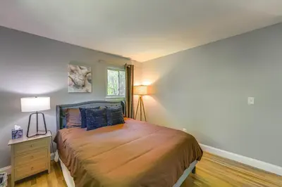 a bedroom with a large bed and a window at NYC-Area Escape Near River, Trails and MTA! in Ossining