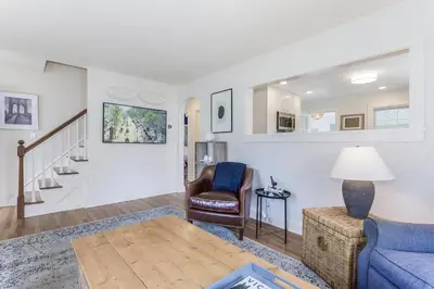 a living room with a couch and a chair at Stay at Black Rock Harbor in Bridgeport