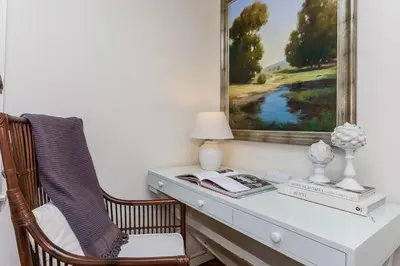 a desk with a chair and a picture on the wall at Stay at Black Rock Harbor in Bridgeport