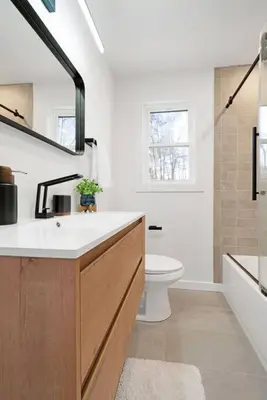 a white bathroom with a sink and a toilet at New Paltz Zen Wellness Cabin w/ Hot Tub in New Paltz