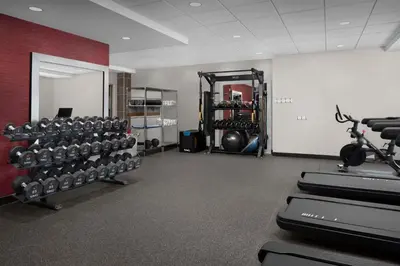 a gym with a bunch of equipment in a room at Home2 Suites By Hilton Poughkeepsie in Poughkeepsie