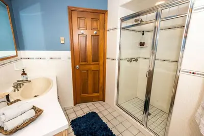 a bathroom with a sink and a shower at Luxury Mountain Mansion Huge Pool, Sauna, 7000sqft in Windham