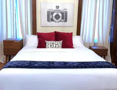 a bedroom with a large bed with a camera on the wall at SWJ544 - Spacious 5BR with Chef's Kitchen in New York