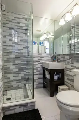 a bathroom with a shower and a toilet and a sink at Private Room at a 3 bedroom Apt at the heart of East Village - shared apartment in New York