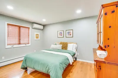 a bedroom with a bed and a window at Pet-Friendly Hopewell Junction Home with Pool in Hopewell Junction
