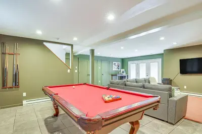 a living room with a red pool table in it at Pet-Friendly Hopewell Junction Home with Pool in Hopewell Junction