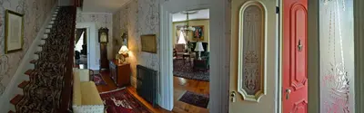 a hallway of a home with a staircase and a living room at Oakcliff Bed and Breakfast in Halfmoon