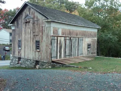 an old wooden building on the side of a road at Oakcliff Bed and Breakfast in Halfmoon