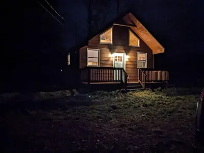 a house at night with the lights on at Mountainscape: Peaceful & Skiing in Roxbury