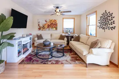 a living room with a couch and a table at Lake Front Home #5 in Hamilton