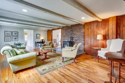 a living room filled with furniture and a fireplace at Historic Farmhouse in Layton with Deck! in Layton