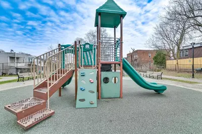 a playground with a slide in a park at Downtown Albany Vacation Rental - Chic and Walkable! in Albany