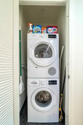 a washer and dryer in a small room at Prime NYC Waterfront Gem in Mott Haven