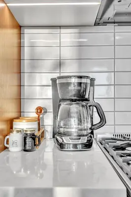 a blender sitting on top of a kitchen counter at Prime NYC Waterfront Gem in Mott Haven