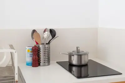 a kitchen counter with a pot and utensils at Garden Guest Suite in Brooklyn