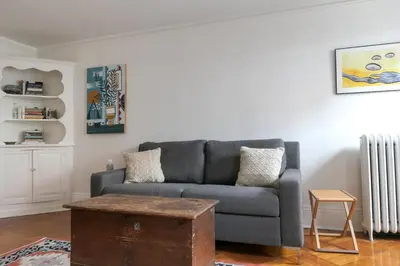 a living room with a couch and a coffee table at Garden Guest Suite in Brooklyn