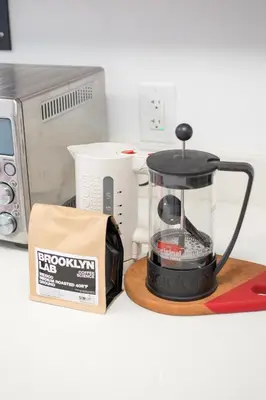 a blender sitting on a counter next to a microwave at Garden Guest Suite in Brooklyn
