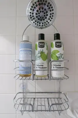 a rack with four bottles of cleaning products in a bathroom at Garden Guest Suite in Brooklyn
