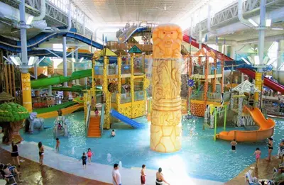 a group of people playing in an indoor water park at Elegant saver spot in Poconos in East Stroudsburg