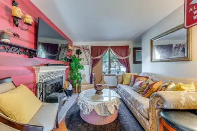 a living room with a couch and a fireplace at Tobyhanna Home with Fire Pit 1 Mi to Lake Carobeth! in Tobyhanna