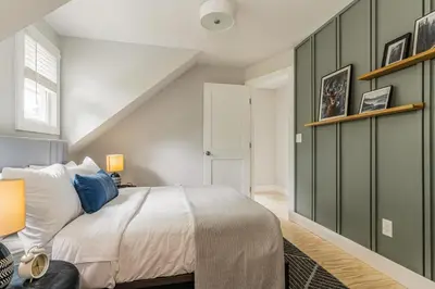 a bedroom with a bed and green walls at Perch Eagle House - Creek Access, Sauna, Mt views in Boiceville