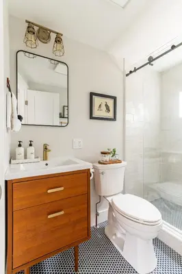 a bathroom with a sink and a toilet and a shower at Perch Eagle House - Creek Access, Sauna, Mt views in Boiceville