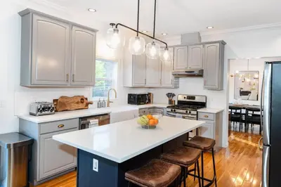 a kitchen with white cabinets and a white counter top at Woodstock Retreat- Heated Pool/Hot Tub/FirePit in Saugerties