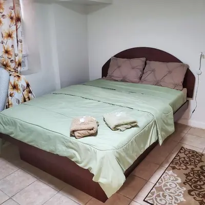 a bedroom with a bed with two towels on it at New Studio apartments Available Now!! in Port Morris