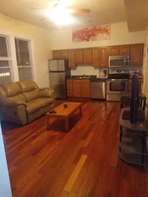 a living room with a couch and a coffee table at simple one bedroom free parking in Schenectady
