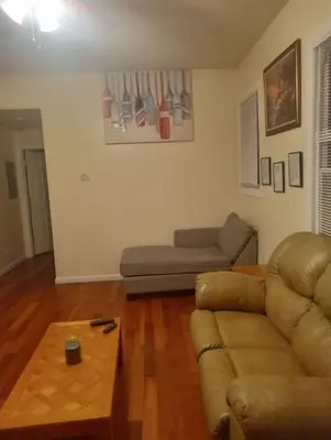 a living room with a couch and a coffee table at simple one bedroom free parking in Schenectady