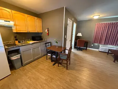 a kitchen and dining room with a table and chairs at Heidi's Inn in Brewster