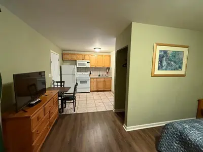 a room with a kitchen and a dining room at Heidi's Inn in Brewster