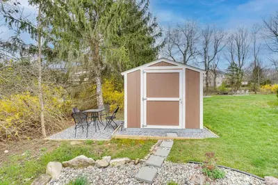 a gazebo in a yard with a table at Dog-Friendly Fishkill Tiny House in Wine Country in Fishkill