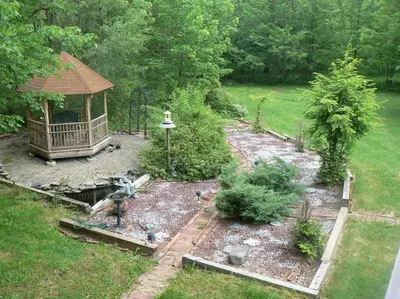 a garden with a gazebo and some plants at Where Memories Are Made in West Kill