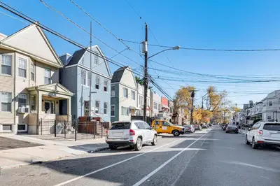 a city street with cars parked on the street at Jersey City Apartment with Game Room 7 Mi to NYC! in Jersey City