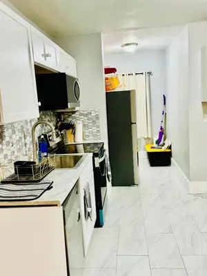 a kitchen with a sink and a refrigerator at fearlessrose vacation Rental 198 in Springfield