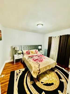 a bedroom with a bed and a rug at fearlessrose vacation Rental 198 in Springfield