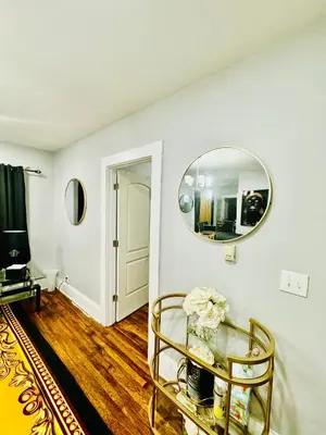 a room with a mirror and a glass table at fearlessrose vacation Rental 198 in Springfield
