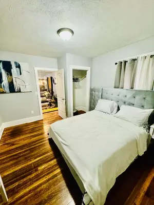 a bedroom with a large white bed in it at fearlessrose vacation Rental 198 in Springfield
