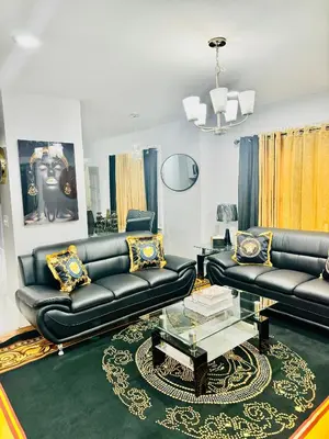 a living room with black leather couches and a table at fearlessrose vacation Rental 198 in Springfield