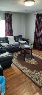 a living room with a couch and a coffee table at Picon Homey in Springfield