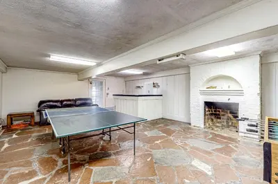 a living room with a ping pong table in it at Group Getaway on Working Farm! Near Saratoga in Ballston Lake