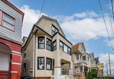 a house with a gambrel roof on top of it at NYC HomeBnB in Jersey City
