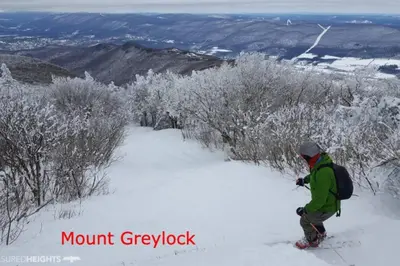 a person on skis in the snow on a mountain at 2 Bed Berkshire Getaway minutes to Jiminy Peak Ski in Hancock
